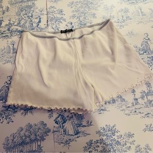 Brandy Melville ripped white cotton sweat shorts with blue elastic waist